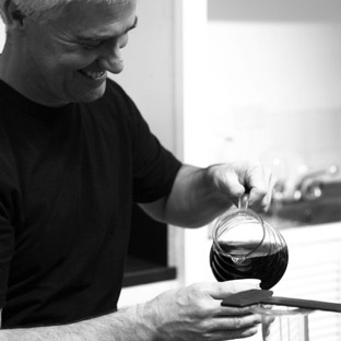 Photo of man pouring a delicious cup of freshly brewed coffee